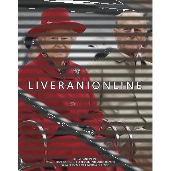Britain\'s Queen Elizabeth II and Prince Philip watch a presentation during a visit to the Cutty Sark in Greenwich, London, Wednesday, April 25, 2012. The Cutty Sark, built in 1869 was one of the last and one of the fastest tea clippers to be built. The Cutty Sark was badly damaged by fire on in May 2007 but after a 50 million pounds ($80.6 million) restoration project the vessel is restored and will reopen to the public on April 26, 2012 ©photoshot/AGENZIA ALDO LIVERANI SAS - ITALY ONLY - REALI INGLESI: Sua Maesta\' la Regina Elisabetta II d\'inghilterra in visita al Museo Nazionale della Marina