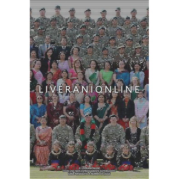 The Prince of Wales, poses for an official photograph with servicemen and their wives during a visit to The First Battalion The Royal Gurkha Rifles at Sir John Moore Barracks, in Folkestone, Kent. ©photoshot/AGENZIA ALDO LIVERANI SAS - ITALY ONLY - REALI INGLESI: Carlo d\'inghilterra, Principe di Galles, durante una visita al primo battaglione The Rifles Gurkha Reali della caserma Sir John Moore, in Folkestone nel Kent. 