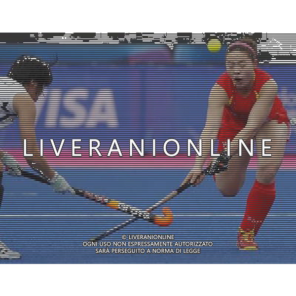 (120505) -- LONDON, May 5, 2012 () -- Peng Yang (R) of China vies with a player of South Korea during the women\'s preliminaries between China and South Korea at the Visa International Invitational Hockey Tournament at Riverbank Arena in the Olympic Park, London, on May 5, 2012. China lost 1-2. (/Wang Lili) AG ALDO LIVERANI S A S ONLY ITALY