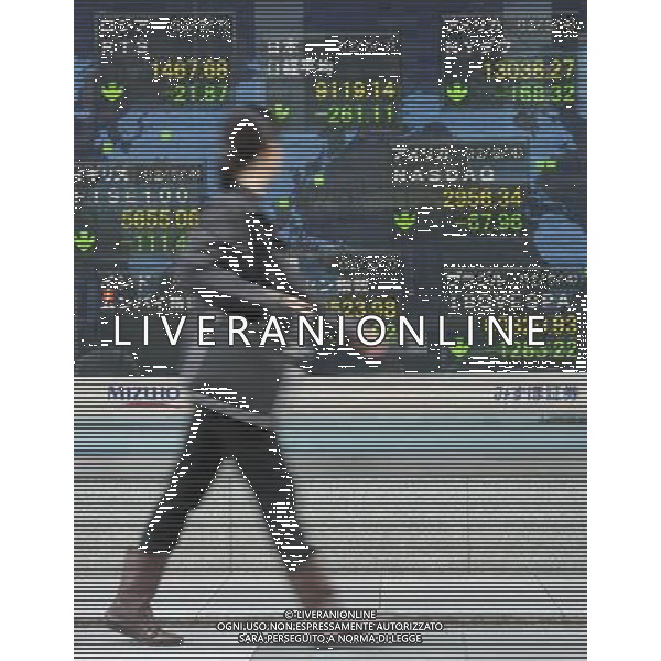 (120507) -- TOKYO, May 7, 2012 () -- A woman passes by an electronic stock board in Tokyo, Japan, May 7, 2012. Nikkei fell to a three-month closing low below 9,200 on Monday, following fresh European concern raised by French and Greek elections. The 225-issue Nikkei Stock Average ended down 261.11 points, or 2.78 percent, from Wednesday at 9,119.14, its lowest closing mark since Feb. 14, when it fell to 9,052.07. (/Kenichiro Seki) (zw) AG ALDO LIVERANI S A S ONLY ITALY