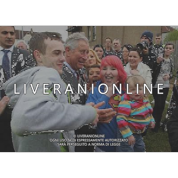 The Prince of Wales poses for a picture with Kaileigh Cassidy (red hair) and Tony Craig (grey jumper) and other locals as he left the North West Area Community Centre in Kilmarnock. The youth project, which was facing closure last year, offers educational, recreational and cultural activities for people aged between five and 25. ©photoshot/AGENZIA ALDO LIVERANI SAS - ITALY ONLY - REALI INGLESI: Il principoe Carlo d\'inghilterra in visita ai giovani del Nord Ovest Progetto a Kilmarnock. Scozia