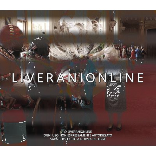 Queen Elizabeth II meets Kenyan Tribesmen during a tea party for the cast of the Diamond Jubilee Pageant at Windsor Castle, Berkshire. ©photoshot/AGENZIA ALDO LIVERANI SAS - ITALY ONLY - REALI INGLESI: La Regina Elisabetta II d\'inghiletrra durante un ricevimento per il giubileo di diamante al Castello di Windsor, Berkshire. Londra