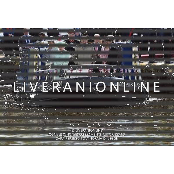 BURNLEY, ENGLAND - MAY 16: Queen Elizabeth II and Prince Philip, Duke of Edinbugh travel on a canal boat through Burnley town centre as part of her Diamond Jubilee tour of the country on May 16, 2012 in Burnley, England. The Queen is visiting many parts of Britain as she celebrates her Diamond Jubilee culminating with a four-day public holiday on June 2-5, including a pageant of 1,000 boats on the River Thames. /ALDO LIVERANI SAS-ITALY ONLY - EDITORIAL USE ONLY
