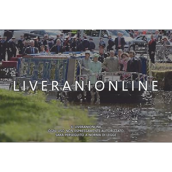 BURNLEY, ENGLAND - MAY 16: Queen Elizabeth II and Prince Philip, Duke of Edinbugh travel on a canal boat through Burnley town centre as part of her Diamond Jubilee tour of the country on May 16, 2012 in Burnley, England. The Queen is visiting many parts of Britain as she celebrates her Diamond Jubilee culminating with a four-day public holiday on June 2-5, including a pageant of 1,000 boats on the River Thames. /ALDO LIVERANI SAS-ITALY ONLY - EDITORIAL USE ONLY