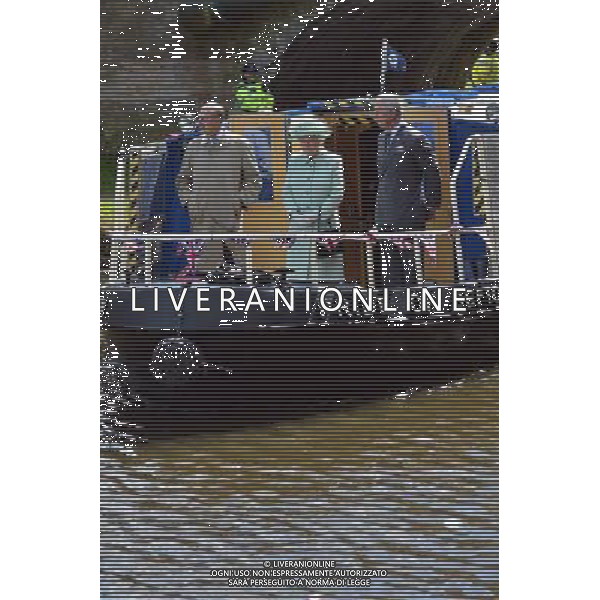 BURNLEY, ENGLAND - MAY 16: Queen Elizabeth II, Prince Philip, Duke of Edinbugh and Prince Charles, Prince of Wales travel on a canal boat through Burnley town centre as part of her Diamond Jubilee tour of the country on May 16, 2012 in Burnley, England. The Queen is visiting many parts of Britain as she celebrates her Diamond Jubilee culminating with a four-day public holiday on June 2-5, including a pageant of 1,000 boats on the River Thames. /ALDO LIVERANI SAS-ITALY ONLY - EDITORIAL USE ONLY