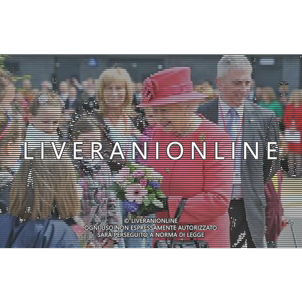 Queen Elizabeth II is presented with flowers during her visit to Orford Jubilee Park, Warrington as part of her visit to the north west. ©photoshot/AGENZIA ALDO LIVERANI SAS - ITALY ONLY - REALI INGLESI: La Regina Elisabetta II durante la sua visita al Orford Jubilee Park