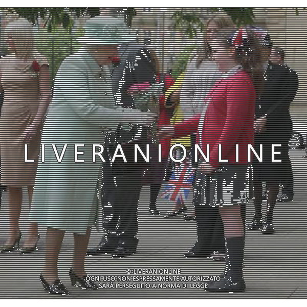 10-year-old Ellena Coglan from Accrington, presents a bouquet to Queen Elizabeth II as she arrives with the Duke of Edinburgh at Accrington Town Hall and Market Hall. The Queen and Duke are taking part in a two day tour as part of this years Jubilee celebrations. ©PHOTOSHOT/AGENZIA ALDO LIVERANI SAS - ITALY ONLY - REALI INGLESI: La Regina Elisabetta II d\'inghilterra in visita al Palazzo Reale Accrington Comune e mercato coperto durante le celebrazioni giubilari.