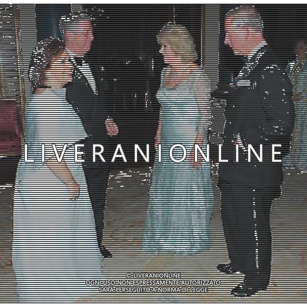 The Prince of Wales and the Duchess of Cornwall greet the Grand-Duke Henri and Grand-Duchess Maria Teresa of Luxembourg as they arrive for a dinner at Buckingham Palace, London, for foreign sovereigns to commemorate the Diamond Jubilee. ©photoshot/Agenzia Aldo Liverani Sas - ITALY ONLY - REALI INGLESI: Carlo Principe di Galles e la Duchessa di Cornovaglia ospite una cena per i sovrani stranieri per commemorare il giubileo di diamante a Buckingham Palace, a Londra. 
