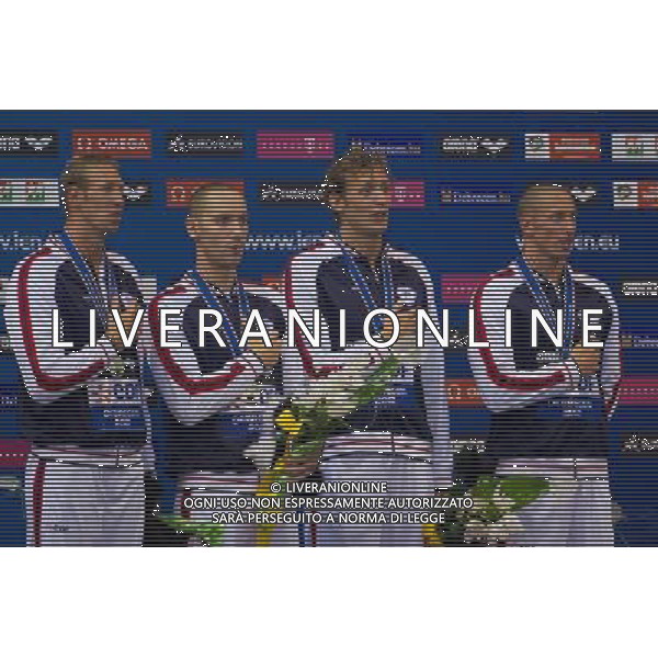 (120522) -- DEBRECEN, May 22, 2012 () -- Members of team France react during the awarding ceremony of the men\'s 4x100m freestyle relay final at the 2012 European Swimming Championships in Debrecen, Hungary on May 21, 2012. Team France won the gold medal with 3 minutes and 13.55 seconds. (/Attila Volgyi) ©photoshot/AGENZIA ALDO LIVERANI SAS - ITALY ONLY - CAMPIONATI EUROPEI NUOTO a Debrecen, in Ungheria 21 maggio 2012.