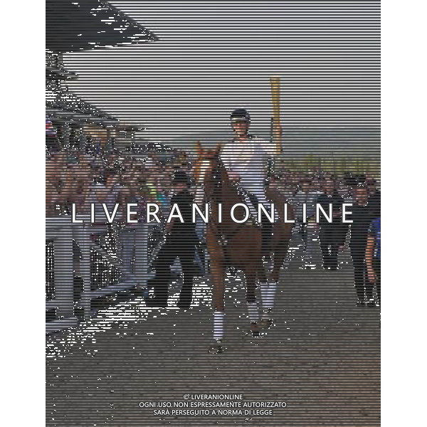  Zara Phillips on Toytown with the Olympic torch at Cheltenham Racecourse as part of the Olympic Torch Evening celebrations Date 23rd May 2012 AG ALDO LIVERANI S A S ONLY ITALY