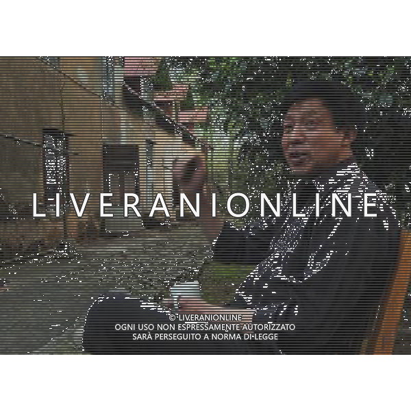 (120530) -- DEQING, May 30, 2012 () -- He Jiyuan, a retired villa keeper, sits in front of a villa built in 1896 on the Mogan Mountain in Deqing County, east China\'s Zhejiang Province. Foreigners began to build villas on the Mogan Mountain since 1896 because of its coolness and quietness. More than 250 villas, temples and chapels are preserved on the mountain. The buildings represent the architectural styles of China, Britain, Russia, the United States, France and Germany, winning the name of \'world modern architecture museum\'. The Mogan villas were listed in the six batch of national key cultural relics units of protection in May 2006. The Mogan Mountain was also selected by the New York Times as one of the 45 Places to Go in 2012. (/Tan Jin) (zkr) ©photoshot/AGENZIA ALDO LIVERANI SAS - ITALY ONLY - Piu\' di 250 ville, templi e cappelle sono conservate sulla montagna nel Monte Mogan in Deqing County, a est della Cina provincia di Zhejian 30 maggio 2012