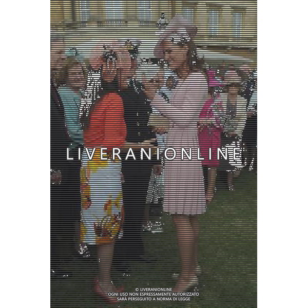 The Duchess of Cambridge laughs as she meets Bethan Haynes (3rd left) during a garden party at Buckingham Palace, London. ©photoshot/AGENZIA ALDO LIVERANI SAS - ITALY ONLY - La duchessa di Cambridge Kate Middleton riceve gli ospiti a Buckingham Palace per il Garden Party in occasione delle celebrazioni del giubileo di diamante della Regina Elisabetta II d\'Inghilterra a Londra il 29 maggio 2012