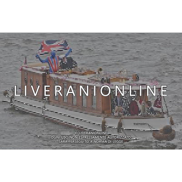  Picture Shows:Various boats take part at the Thames Diamond Jubilee Pageant to celebrate Her Majesty The Queen Elizabeth 2nd\'s 60 years as monarch of the United Kingdom. It is one of the largest flotillas ever assembled on the river. Rowed boats and working boats and pleasure vessels of all shapes and sizes will be beautifully dressed with streamers and Union Flags, their crews and passengers turned out in their finest rigs. The armed forces, fire, police, rescue and other services will be afloat and there will be an exuberance of historic boats, wooden launches, steam vessels and other boats of note. Date 03rd June 2012 *World Rights Only* *Unbylined uses will incur an additional discretionary fee!* /PHOTOSHOT/AG ALDO LIVERANI SAS - ITALY ONLY -