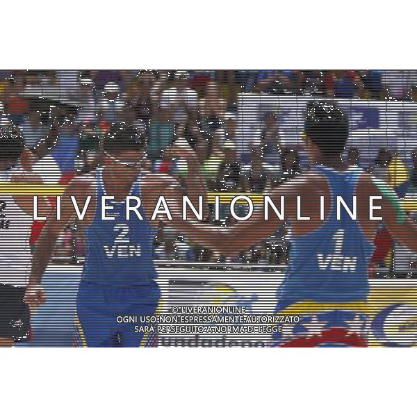 (120603) -- NAGUANAGUA, June 3, 2012 () -- Jackson Rodriguez (R Front) and Farid Mussa (L Front) of Venezuela celebrate their victory after the match \'B\' against Chile during the Intercontinental Cup pre-Olympic beach Voleyball, in Naguanagua, Venezuela, on June 2, 2012. Venezuela won 2-0. (/Juan Carlos Hernandez) (jh) (jp) (py) AG ALDO LIVERANI S A S ONLY ITALY