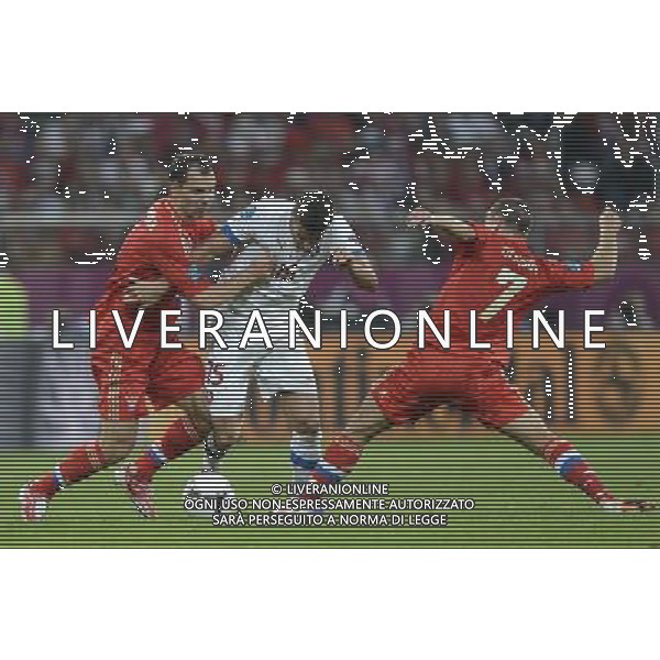 (120609) -- WROCLAW, June 9, 2012 () -- Milan Baros (C) of the Czech Republic vies with Sergei Ignashevich (L) and Igor Denisov of Russia during their Group A match at the Euro 2012 football championships in Wroclaw, Poland, June 8, 2012. Russia won 4-1. (/Wu Wei) (jyc) ©PHOTOSHOT/Agenzia Aldo Liverani Sas - ITALY ONLY: Russia - Repubblica Ceca Campionati Europei UEFA 2012 Polonia/Ucraina Gruppo A Wroclaw (Polonia) 08/06/2012 