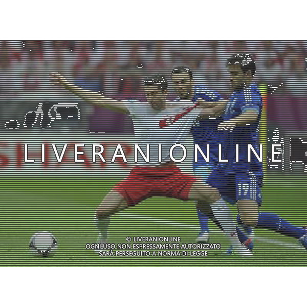(120609) -- WARSAW, June 9, 2012 () -- Artur Sobiech (L) of Poland vies with Sokratis Papastathopoulos (R) of Greece during their Group A match at the Euro 2012 football championship in Warsaw, Poland, June 8, 2012. (/Ma Ning) (jyc) ©photoshot/Agenzia Aldo Liverani Sas - ITALY ONLY: Polonia - Grecia Campionati Europei UEFA 2012 Polonia/Ucraina Gruppo A Varsavia (Polonia) 08/06/2012