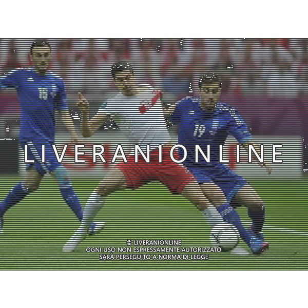 (120609) -- WARSAW, June 9, 2012 () -- Robert Lewandowski (C) of Poland vies with Sokratis Papastathopoulos (R) of Greece during their Group A match at the Euro 2012 football championship in Warsaw, Poland, June 8, 2012. (/Ma Ning) (jyc) ©photoshot/Agenzia Aldo Liverani Sas - ITALY ONLY: Polonia - Grecia Campionati Europei UEFA 2012 Polonia/Ucraina Gruppo A Varsavia (Polonia) 08/06/2012