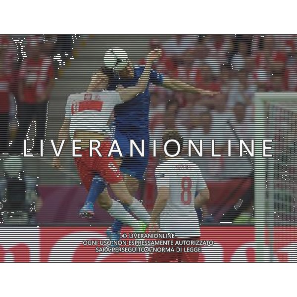 (120609) -- WARSAW, June 9, 2012 () -- Robert Lewandowski (L) of Poland heads the ball during the Group A match against Greece at the Euro 2012 football championship in Warsaw, Poland, June 8, 2012. The match ended in a 1-1 draw. (/Liu Lihang) (jyc) ©photoshot/Agenzia Aldo Liverani Sas - ITALY ONLY: Polonia - Grecia Campionati Europei UEFA 2012 Polonia/Ucraina Gruppo A Varsavia (Polonia) 08/06/2012