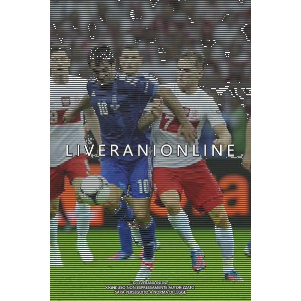 (120609) -- WARSAW, June 9, 2012 () -- Giorgos Karagounis (C) of Greece vies with Eugen Polanski (R) of Poland during their Group A match at the Euro 2012 football championship in Warsaw, Poland, June 8, 2012. The match ended in a 1-1 draw. (/Ma Ning) (jyc) ©photoshot/Agenzia Aldo Liverani Sas - ITALY ONLY: Polonia - Grecia Campionati Europei UEFA 2012 Polonia/Ucraina Gruppo A Varsavia (Polonia) 08/06/2012