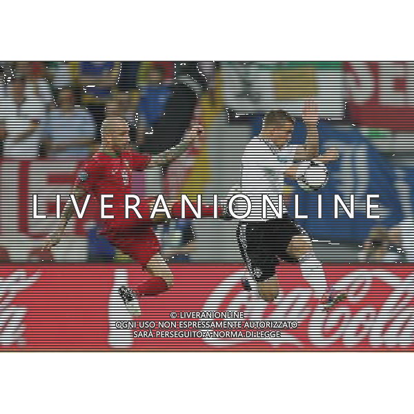 LWOW STADION OLIMPIJSKI 09.06.2012 EURO 2012 PILKA NOZNA GRUPA B NIEMCY - PORTUGALIA NZ RAUL MEIRELES POR LUKAS PODOLSKI GER FOT MICHAL NOWAK / NEWSPIX.PL LVIV OLYMPIC STADIUM 09.06.2012 EURO 2012 GROUP B GERMANY - PORTUGAL RAUL MEIRELES POR LUKAS PODOLSKI GER MICHAL NOWAK / NEWSPIX.PL --- Newspix.pl /Agenzia Aldo Liverani Sas - ITALY ONLY: Germania - Portogallo Campionati Europei UEFA 2012 Polonia/Ucraina Gruppo B Leopoli (Ucraina) 09/06/2012 *** Local Caption *** www.newspix.pl mail us: info@newspix.pl call us: 0048 022 23 22 222 --- Polish Picture Agency by Ringier Axel Springer Poland