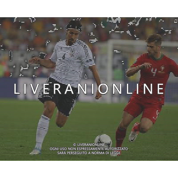 09.06.2012, LWOW, PILKA NOZNA, FOOTBALL, MISTRZOSTWA EUROPY W PILCE NOZNEJ, EURO 2012, FOOTBALL EUROPEAN CHAMPIONSHIP, NIEMCY - PORTUGALIA, GERMANY - PORTUGAL, SAMI KHEDIRA (GER), MIGUEL VELOSO (POR) , FOT. TOMASZ JASTRZEBOWSKI / FOTO OLIMPIK/NEWSPIX.PL --- Newspix.pl /Agenzia Aldo Liverani Sas - ITALY ONLY: Germania - Portogallo Campionati Europei UEFA 2012 Polonia/Ucraina Gruppo B Leopoli (Ucraina) 09/06/2012 *** Local Caption *** www.newspix.pl mail us: info@newspix.pl call us: 0048 022 23 22 222 --- Polish Picture Agency by Ringier Axel Springer Poland