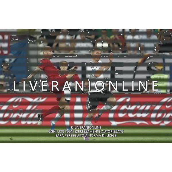 LWOW 09.06.2012 MECZ MISTRZOSTWA EUROPY 2012 GRUPA B: NIEMCY - PORTUGALIA --- UEFA EURO 2012 CHAMPIONSHIP GROUP B MATCH IN LVIV: GERMANY - PORTUGAL RAUL MEIRELES LUKASZ PODOLSKI FOT. PIOTR KUCZA/NEWSPIX.PL --- Newspix.pl /Agenzia Aldo Liverani Sas - ITALY ONLY: Germania - Portogallo Campionati Europei UEFA 2012 Polonia/Ucraina Gruppo B Leopoli (Ucraina) 09/06/2012 *** Local Caption *** www.newspix.pl mail us: info@newspix.pl call us: 0048 022 23 22 222 --- Polish Picture Agency by Ringier Axel Springer Poland