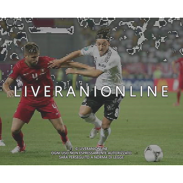 LWOW STADION OLIMPIJSKI 09.06.2012 EURO 2012 PILKA NOZNA GRUPA B NIEMCY - PORTUGALIA NZ MIGUEL VELOSO POR MESUT OEZIL GER FOT MICHAL NOWAK / NEWSPIX.PL LVIV OLYMPIC STADIUM 09.06.2012 EURO 2012 GROUP B GERMANY - PORTUGAL MIGUEL VELOSO POR MESUT OEZIL GER MICHAL NOWAK / NEWSPIX.PL --- Newspix.pl /Agenzia Aldo Liverani Sas - ITALY ONLY: Germania - Portogallo Campionati Europei UEFA 2012 Polonia/Ucraina Gruppo B Leopoli (Ucraina) 09/06/2012 *** Local Caption *** www.newspix.pl mail us: info@newspix.pl call us: 0048 022 23 22 222 --- Polish Picture Agency by Ringier Axel Springer Poland