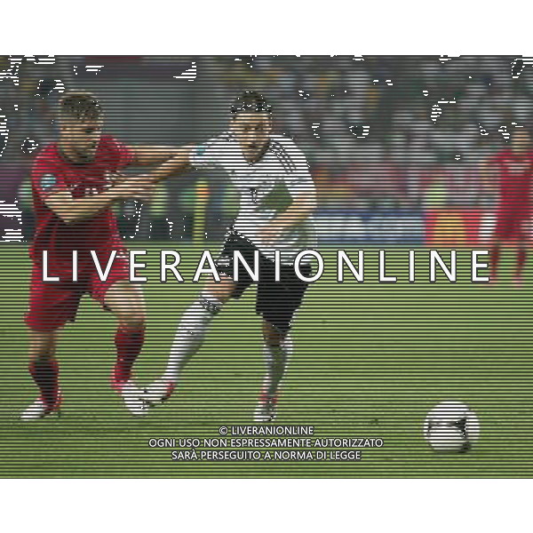LWOW STADION OLIMPIJSKI 09.06.2012 EURO 2012 PILKA NOZNA GRUPA B NIEMCY - PORTUGALIA NZ MIGUEL VELOSO POR MESUT OEZIL GER FOT MICHAL NOWAK / NEWSPIX.PL LVIV OLYMPIC STADIUM 09.06.2012 EURO 2012 GROUP B GERMANY - PORTUGAL MIGUEL VELOSO POR MESUT OEZIL GER MICHAL NOWAK / NEWSPIX.PL --- Newspix.pl /Agenzia Aldo Liverani Sas - ITALY ONLY: Germania - Portogallo Campionati Europei UEFA 2012 Polonia/Ucraina Gruppo B Leopoli (Ucraina) 09/06/2012 *** Local Caption *** www.newspix.pl mail us: info@newspix.pl call us: 0048 022 23 22 222 --- Polish Picture Agency by Ringier Axel Springer Poland