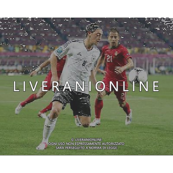 LWOW STADION OLIMPIJSKI 09.06.2012 EURO 2012 PILKA NOZNA GRUPA B NIEMCY - PORTUGALIA NZ MESUT OEZIL GER JOAO PEREIRA POR FOT MICHAL NOWAK / NEWSPIX.PL LVIV OLYMPIC STADIUM 09.06.2012 EURO 2012 GROUP B GERMANY - PORTUGAL MESUT OEZIL GER JOAO PEREIRA POR MICHAL NOWAK / NEWSPIX.PL --- Newspix.pl /Agenzia Aldo Liverani Sas - ITALY ONLY: Germania - Portogallo Campionati Europei UEFA 2012 Polonia/Ucraina Gruppo B Leopoli (Ucraina) 09/06/2012 *** Local Caption *** www.newspix.pl mail us: info@newspix.pl call us: 0048 022 23 22 222 --- Polish Picture Agency by Ringier Axel Springer Poland