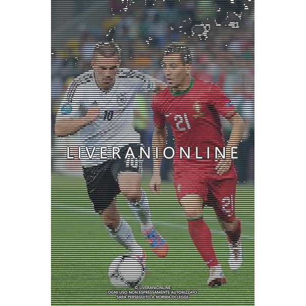 09.06.2012 LWOW - STADION ARENA LWOW ( LVIV UKRAINE STADIUM ARENA LVIV ) PILKA NOZNA ( FOOTBALL ) MISTRZOSTWA EUROPY W PILCE NOZNEJ UEFA EURO 2012 ( EUROPEAN CHAMPIONSHIPS UEFA EURO 2012 ) GRUPA B ( POOL B ) MECZ NIEMCY - PORTUGALIA ( GAME GERMANY - PORTUGAL ) NZ LUKAS PODOLSKI (L), JOAO PEREIRA (P) FOTO MICHAL STANCZYK / CYFRASPORT/NEWSPIX.PL --- Newspix.pl /Agenzia Aldo Liverani Sas - ITALY ONLY: Germania - Portogallo Campionati Europei UEFA 2012 Polonia/Ucraina Gruppo B Leopoli (Ucraina) 09/06/2012 *** Local Caption *** www.newspix.pl mail us: info@newspix.pl call us: 0048 022 23 22 222 --- Polish Picture Agency by Ringier Axel Springer Poland