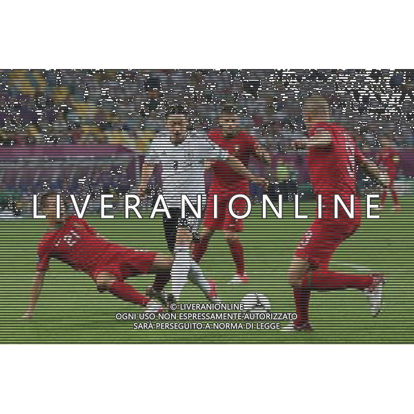 LWOW 09.06.2012 MECZ MISTRZOSTWA EUROPY 2012 GRUPA B: NIEMCY - PORTUGALIA --- UEFA EURO 2012 CHAMPIONSHIP GROUP B MATCH IN LVIV: GERMANY - PORTUGAL JOAO PEREIRA MESUT OZIL PEPE FOT. PIOTR KUCZA/NEWSPIX.PL --- Newspix.pl /Agenzia Aldo Liverani Sas - ITALY ONLY: Germania - Portogallo Campionati Europei UEFA 2012 Polonia/Ucraina Gruppo B Leopoli (Ucraina) 09/06/2012 *** Local Caption *** www.newspix.pl mail us: info@newspix.pl call us: 0048 022 23 22 222 --- Polish Picture Agency by Ringier Axel Springer Poland