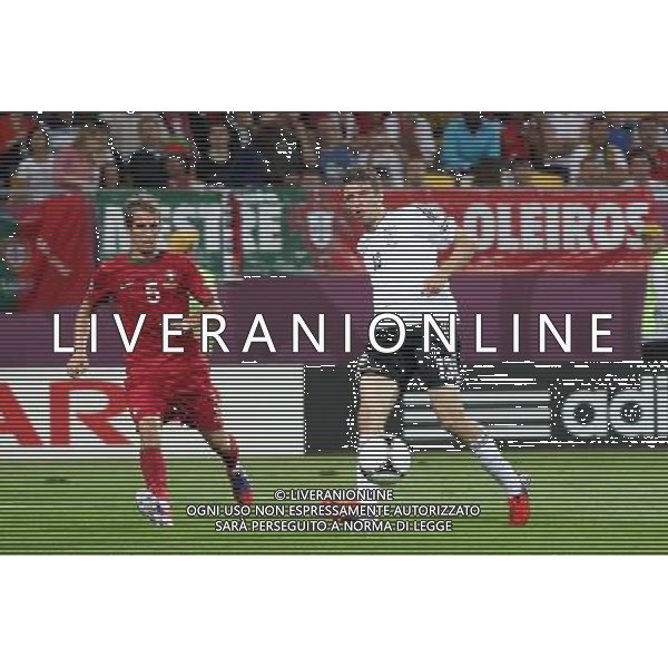 LWOW 09.06.2012 MECZ MISTRZOSTWA EUROPY 2012 GRUPA B: NIEMCY - PORTUGALIA --- UEFA EURO 2012 CHAMPIONSHIP GROUP B MATCH IN LVIV: GERMANY - PORTUGAL FABIO COENTRAO THOMAS MULLER FOT. PIOTR KUCZA/NEWSPIX.PL --- Newspix.pl /Agenzia Aldo Liverani Sas - ITALY ONLY: Germania - Portogallo Campionati Europei UEFA 2012 Polonia/Ucraina Gruppo B Leopoli (Ucraina) 09/06/2012 *** Local Caption *** www.newspix.pl mail us: info@newspix.pl call us: 0048 022 23 22 222 --- Polish Picture Agency by Ringier Axel Springer Poland