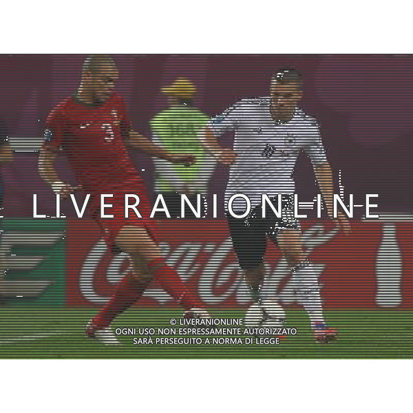 09.06.2012, LWOW, PILKA NOZNA, FOOTBALL, MISTRZOSTWA EUROPY W PILCE NOZNEJ, EURO 2012, FOOTBALL EUROPEAN CHAMPIONSHIP, NIEMCY - PORTUGALIA, GERMANY - PORTUGAL, PEPE (POR), LUKAS PODOLSKI (GER), FOT. TOMASZ JASTRZEBOWSKI / FOTO OLIMPIK/NEWSPIX.PL --- Newspix.pl *** Local Caption *** www.newspix.pl mail us: info@newspix.pl call us: 0048 022 23 22 222 --- Polish Picture Agency by Ringier Axel Springer Poland