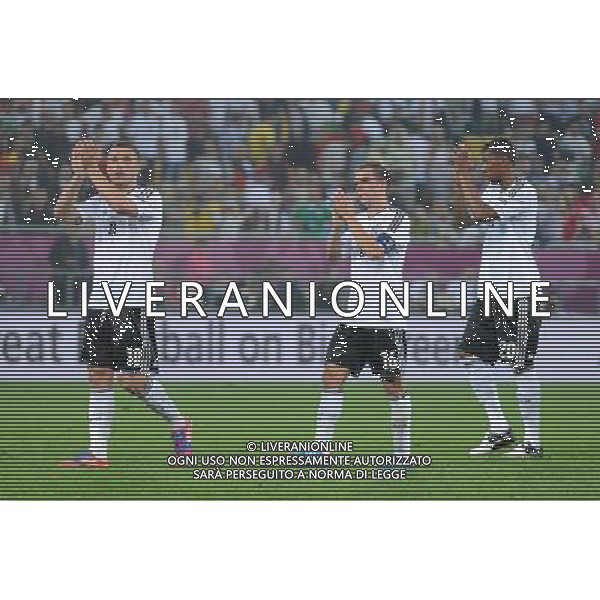 09.06.2012 LWOW - STADION ARENA LWOW ( LVIV UKRAINE STADIUM ARENA LVIV ) PILKA NOZNA ( FOOTBALL ) MISTRZOSTWA EUROPY W PILCE NOZNEJ UEFA EURO 2012 ( EUROPEAN CHAMPIONSHIPS UEFA EURO 2012 ) GRUPA B ( POOL B ) MECZ NIEMCY - PORTUGALIA ( GAME GERMANY - PORTUGAL ) NZ LUKAS PODOLSKI , PHILIPP LAHM , JEROME BOATENG , RADOSC BRAMKA GOL FOTO MICHAL STANCZYK / CYFRASPORT/NEWSPIX.PL --- Newspix.pl *** Local Caption *** www.newspix.pl mail us: info@newspix.pl call us: 0048 022 23 22 222 --- Polish Picture Agency by Ringier Axel Springer Poland