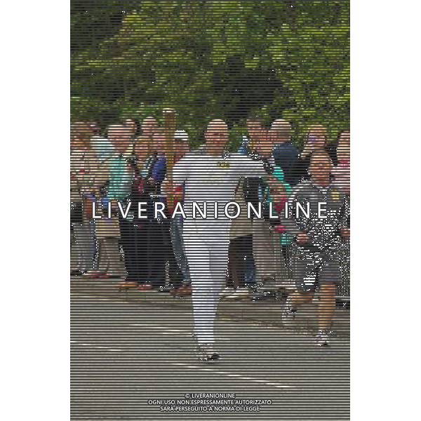 Olympic Torch Relay carried by Gregor Grant a triathlete from Kilmarock ©PHOTOSHOT/Agenzia Aldo Liverani Sas - ITALY ONLY - La torcia olimpica portata da Gregor Grant atleta di triathlon da Kilmarock