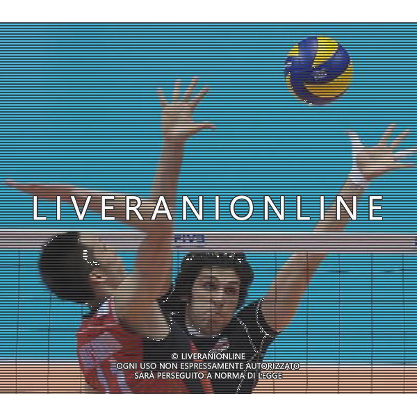 (120610) -- TOKYO, June 10, 2012 () -- Iran\'s Hamzeh Zarini (R) blocks the ball during the men\'s volleyball qualifying tournament match against Japan for the London 2012 Olympics in Tokyo, Japan, on June 10, 2012. Iran won 3-0. (/Kenichiro Seki) AG ALDO LIVERANI S A S ONLY ITALY