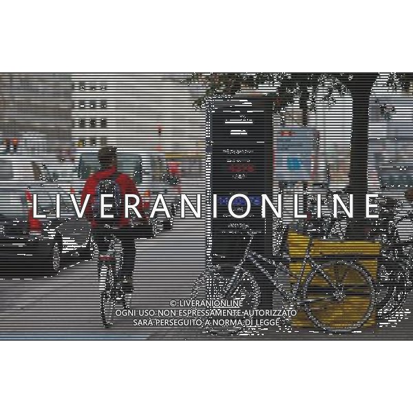 (120614) -- COPENHAGEN, June 14, 2012 () -- A man rides past a bicycle traffic mornitor in Copenhagen, capital of Denmark, June 13, 2012. (/Zhou Lei) AG ALDO LIVERANI S A S ONLY ITALY