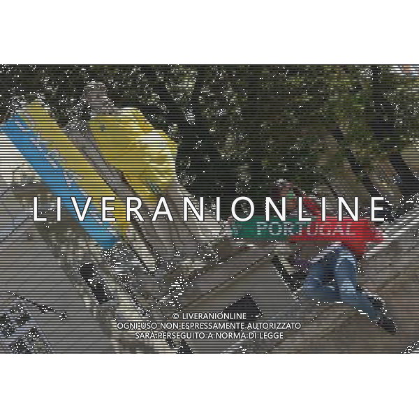 (120614) -- LVIV, June 14, 2012 () -- A fan of Portugal poses for a photo in Lviv, Ukraine, which is the host city for matches of Euro 2012 football championships Group B. (/Ma Ning) (bxf) ©photoshot/AGENZIA ALDO LIVERANI SAS - ITALY ONLY - Lviv, in Ucraina, citta\' ospitante delle partite dei campionati di calcio Euro 2012 Group B, 14 giugno 2012