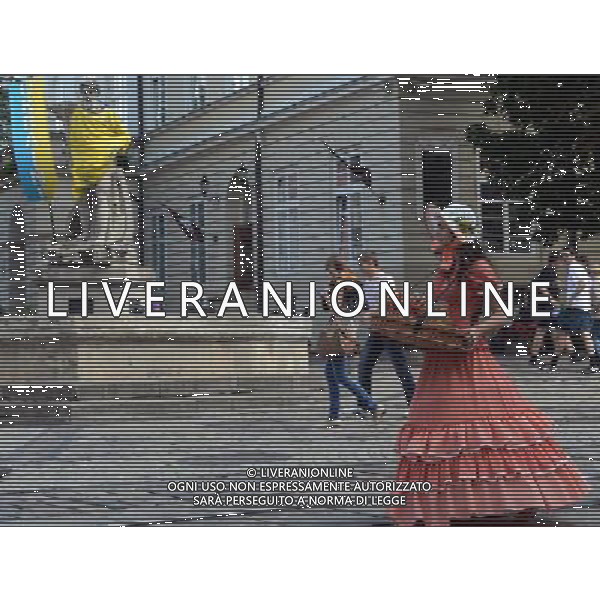 (120614) -- LVIV, June 14, 2012 () -- A girl sells candies at a square in Lviv, Ukraine, on June 13, 2012. Lviv is the host city for matches of Euro 2012 football championships Group B. (/Ma Ning) (bxf) ©photoshot/AGENZIA ALDO LIVERANI SAS - ITALY ONLY - Lviv, in Ucraina, citta\' ospitante delle partite dei campionati di calcio Euro 2012 Group B, 14 giugno 2012