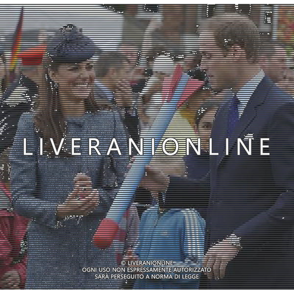 Britain\'s Catherine, Duchess of Cambridge laughs as her husband Prince William holds a foam javelin at a children\'s sports event, during their visit to Vernon Park in Nottingham, central England June 13, 2012. /PHOTOSHOT/AG ALDO LIVERANI SAS - ITALY ONLY - *** Local Caption *** .