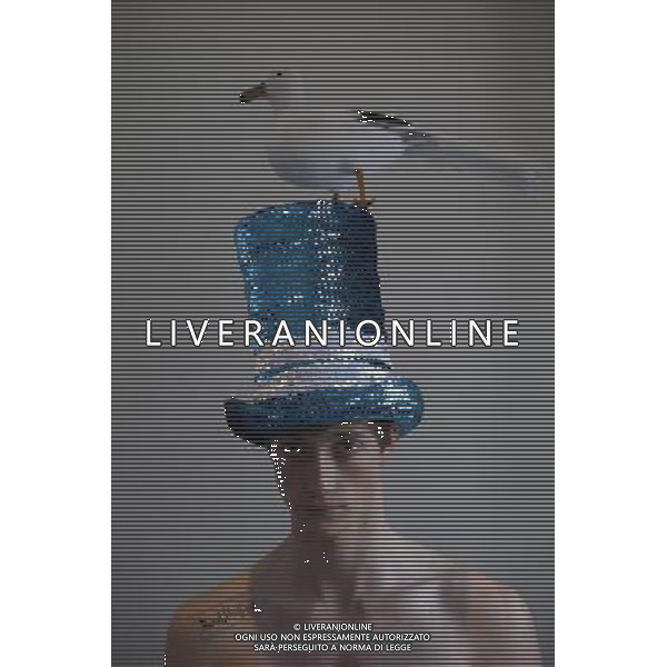 A model wear a hat by David Shilling during a mens hat show in London, Britain, on 14 June 2012.London born David Shilling now lives and works in Monaco creating commissioned monumental sculptures in steel, 3D paintings, metal furniture,jewellery and, of course,his unique hats ©photohsot/Agenzia Aldo Liverani Sas - ITALY ONLY - La mostra dei cappelli da uomo di David Shilling a Londra, Gran Bretagna, 14 giugno 2012. Il famoso stilista inglese ora vive e lavora a Monaco ed e\' il creatore di sculture monumentali in acciaio, dipinti in 3D, mobili metallici, gioielli e, naturalmente, i suoi cappelli unici