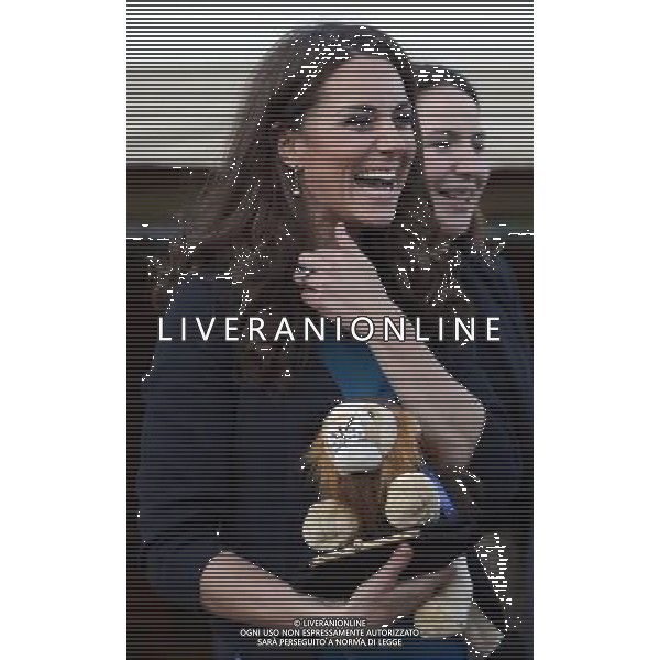 The Duchess of Cambridge is presented with an Aslan lion toy as she hosts 150 children and young people from The Art Room at a performance of The Lion, The Witch and The Wardrobe at Kensington Gardens, London. Photo. Picture date: Friday June 15, 2012. Kate. Photo credit should read: ©photoshot/Agenzia Aldo Liverani Sas - ITALY ONLY - REALI INGLESI: Kate Middleton, duchessa di Cambridge a teatro a Kensington Gardens, Londra 15 giugno 2012.
