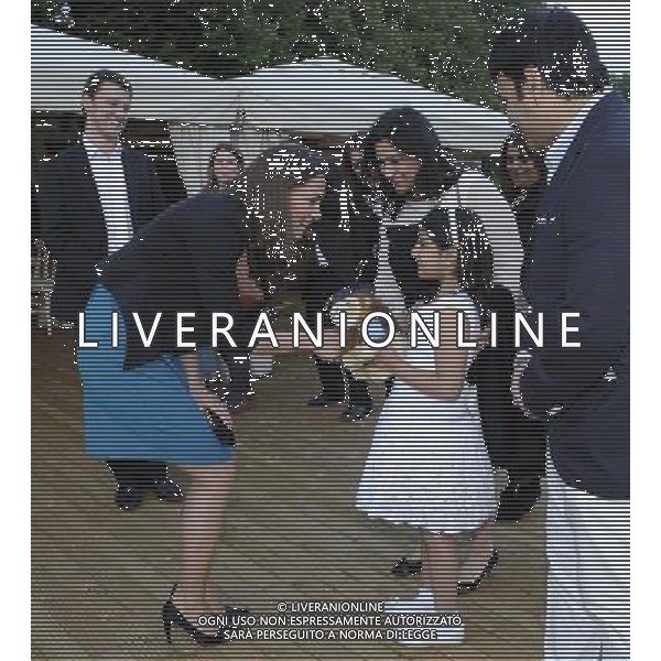 The Duchess of Cambridge is presented with an Aslan lion toy by Suhani Kapoor as she hosts 150 children and young people from The Art Room at a performance of The Lion, The Witch and The Wardrobe at Kensington Gardens, London. Photo. Picture date: Friday June 15, 2012. Kate. Photo credit should read: ©photoshot/Agenzia Aldo Liverani Sas - ITALY ONLY - REALI INGLESI: Kate Middleton, duchessa di Cambridge a teatro a Kensington Gardens, Londra 15 giugno 2012.