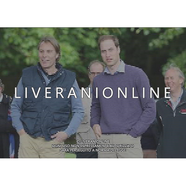 LYMPNE, ENGLAND - JUNE 06: (L-R) Damien Aspinall, Prince William, Duke of Cambridge and Charlie Mayhew of Tusk smile during a visit to Port Lympne Wild Animal Park on June 6, 2012 in Port Lympne, England. Prince William, Duke of Cambridge was visiting the park to meet staff and rhinos involved in a translocation project. The Aspinall Foundation along with the Tusk Trust and the George Adamson Trust are combining forces to stage a rare translocation of three captive born black rhino to Mkomazi National Park in Tanzania in order to rejuvenate numbers of the black rhino in the area. The three animals are being airlifted in a dedicated DHL Boeing 757 from Manston Airport in Kent direct to Kilimanjaro Int Airport in Tanzania. The three black rhino have been donated by Damian Aspinall, Chairman of The Aspinall Foundation, from their breeding group at Port Lympne Wild Animal Park in Kent. The reintroduction of endangered species to the wild to assist breeding programmes is a major focus of The Aspinall Foundation. Prince William, Duke of Cambridge as Patron of Tusk Trust and a dedicated campaigner against poaching visited the rhinos at Port Lympne ahead of their translocation and today released a speech via the BBC highlighting his dedication to the fight against the illegal trade of ivory. /PHOTOSHOT/ALDO LIVERANI