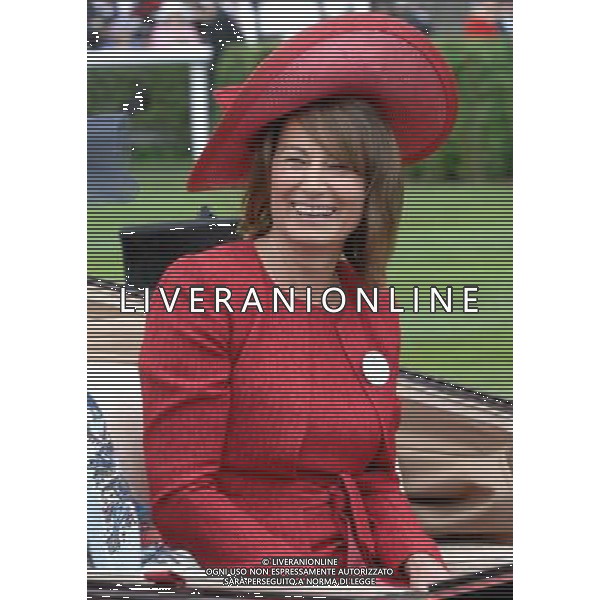 Ladies Day at Royal Ascot is traditionally seen as the height of English fashion, and even this yearÍs wet weather has not dampened the event. Ascot, Berkshire. England.Carol Middleton arrives on Ladies Day with her husband Michael. 21-6-12 /PHOTOSHOT/ALDO LIVERANI SAS - ITALY ONLY