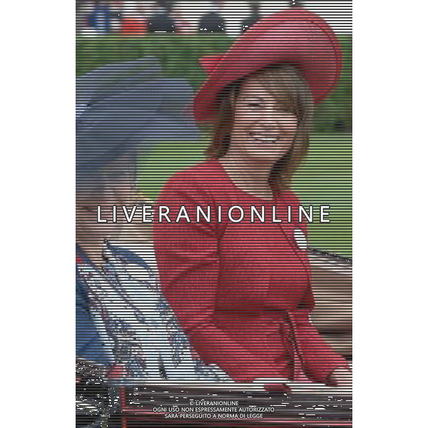 Ladies Day at Royal Ascot is traditionally seen as the height of English fashion, and even this yearÍs wet weather has not dampened the event. Ascot, Berkshire. England.Carol Middleton arrives on Ladies Day with her husband Michael. 21-6-12 /PHOTOSHOT/ALDO LIVERANI SAS - ITALY ONLY
