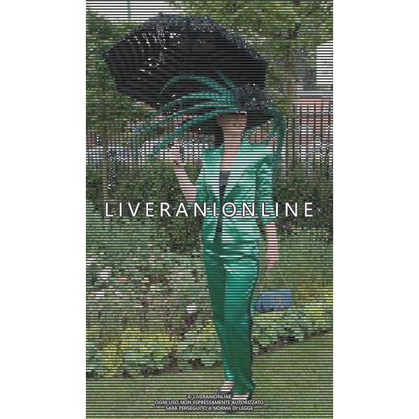 Ladies Day at Royal Ascot is traditionally seen as the height of English fashion, and even this yearÍs wet weather has not dampened the event. Ascot, Berkshire. England. 21-6-12 /PHOTOSHOT/ALDO LIVERANI SAS - ITALY ONLY