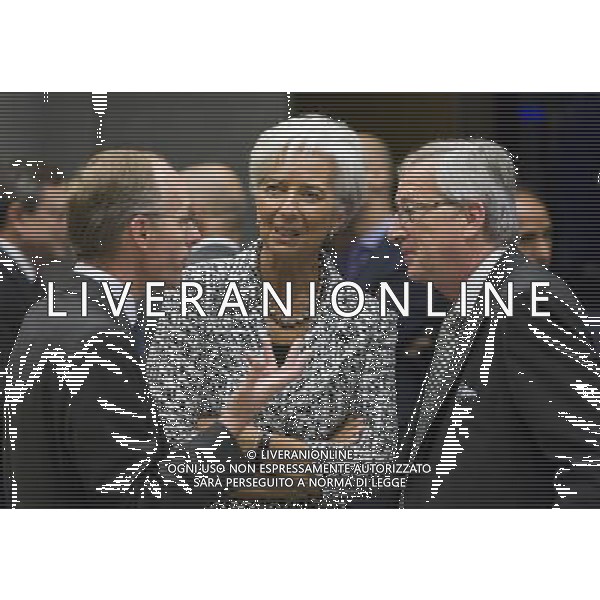 (120621) -- LUXEMBOURG, June 21, 2012 () -- International Monetary Fund (IMF) Managing Director Christine Lagarde (C) is surrounded by Luxembourg\'s Prime Minister and Eurogroup chairman Jean-Claude Juncker (R) and Luxembourg Finance Minister Luc Frieden (L) during the Eurogroup finance ministers\' meeting in Luxembourg, on June 21, 2012. Eurozone finance ministers gathered here on Thursday to discuss a rescue plan for Spain\'s ailing banks and the situation in Greece after elections, preparing the way for a crucial summit on the debt crisis next week. (/Thierry Monasse) /PHOTOSHOT/ALDO LIVERANI SAS - ITALY ONLY