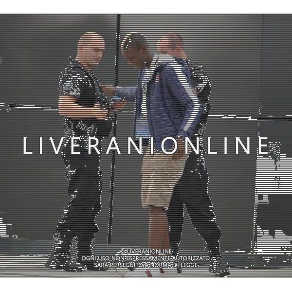 !!!UWAGA PAPARAZZI!!! BRAK ZGODY NA PUBLIKACJE. AUTOR NIE PONOSI ODPOWIEDZIALNOSCI ZA SKUTKI PRAWNE ZWIAZANE Z PUBLIKACJA. KRAKOW 26.06.2012 MLODSZY BRAT MARIO BALOTELLI ENOCH BALOTELII W CZASIE TRENINGU REPREZENTACJI WLOCHY PRZED STADIONIEM CRACOVIA KRAKOW KAPKOWAL Z OCHRONIARZEM. ZROBIL SOBIE TEZ PAMIATKOWE ZDJECIE Z POLICJA. NA SAM KONIEC UCIEKAL PRZED PAPARAZZI. N Z ENOCH BALOTELLI ROBI SOBIE PAMIATKOWE ZDJECIE Z POLICJANTAMI FOT. JAKUB GRUCA/ TOMASZ JAGODZINSKI/ NEWSPIX.PL --- Newspix.pl Little Brother Enoch BALOTELII Mario Balotelli during training REPRESENTATION FROM ITALY Cracovia Krakow stadium played ball with the bodyguard. DO a commemorative picture with the police. At the end I was running away from paparazzi. ENOCH BALOTELLI FRATELLO DI MARIO BALOTELLI GIOCA A CALCIO CON LA POLIZIA IN POLONIA NEL RITIRO DELL\'ITALIA PH.AG ALDO LIVERANI SAS - ITALY ONLY - *** Local Caption *** www.newspix.pl mail us: info@newspix.pl call us: 0048 022 23 22 222 --- Polish Picture Agency by Ringier Axel Springer Poland