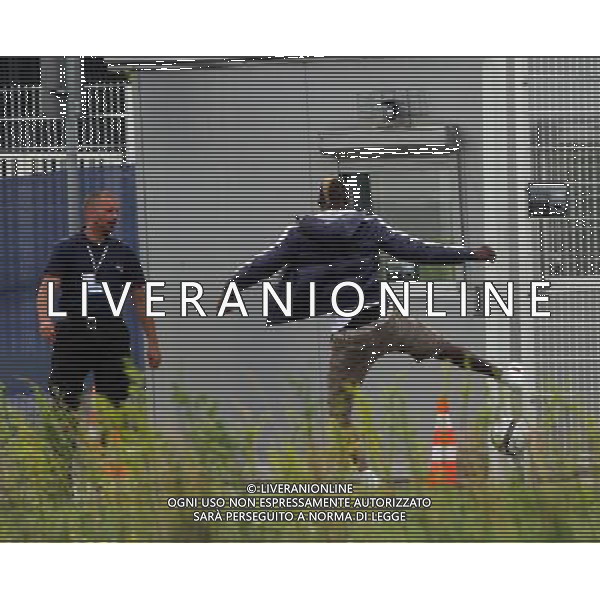 !!!UWAGA PAPARAZZI!!! BRAK ZGODY NA PUBLIKACJE. AUTOR NIE PONOSI ODPOWIEDZIALNOSCI ZA SKUTKI PRAWNE ZWIAZANE Z PUBLIKACJA. KRAKOW 26.06.2012 MLODSZY BRAT MARIO BALOTELLI ENOCH BALOTELII W CZASIE TRENINGU REPREZENTACJI WLOCHY PRZED STADIONIEM CRACOVIA KRAKOW KAPKOWAL Z OCHRONIARZEM. ZROBIL SOBIE TEZ PAMIATKOWE ZDJECIE Z POLICJA. NA SAM KONIEC UCIEKAL PRZED PAPARAZZI. N Z ENOCH BALOTELLI KAPKUJE Z FUNCKJONARIUSZEM OCHRONY FOT. JAKUB GRUCA/ TOMASZ JAGODZINSKI/ NEWSPIX.PL --- Newspix.pl Little Brother Enoch BALOTELII Mario Balotelli during training REPRESENTATION FROM ITALY Cracovia Krakow stadium played ball with the bodyguard. DO a commemorative picture with the police. At the end I was running away from paparazzi. ENOCH BALOTELLI FRATELLO DI MARIO BALOTELLI GIOCA A CALCIO CON LA POLIZIA IN POLONIA NEL RITIRO DELL\'ITALIA PH.AG ALDO LIVERANI SAS - ITALY ONLY - *** Local Caption *** www.newspix.pl mail us: info@newspix.pl call us: 0048 022 23 22 222 --- Polish Picture Agency by Ringier Axel Springer Poland